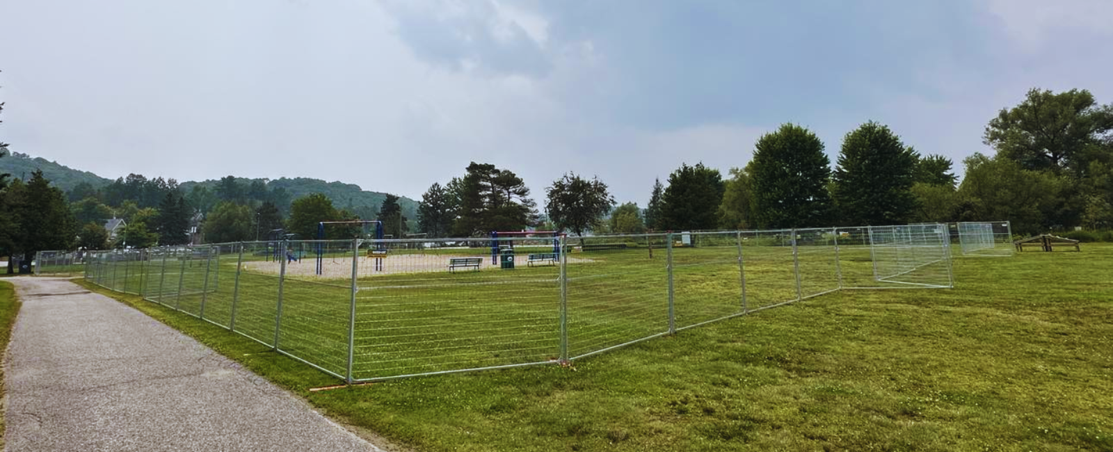 head lake park playground with fence around it